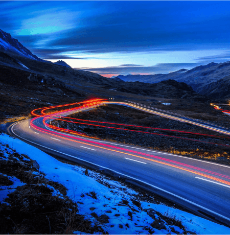 Light trails across an Alpine landscape